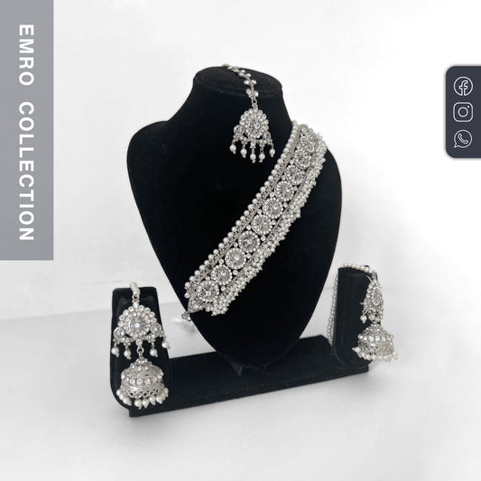 Explore the Silver Choker Set – a luxurious Indian choker necklace with earrings and tikka, perfect bridal jewelry for weddings and events.