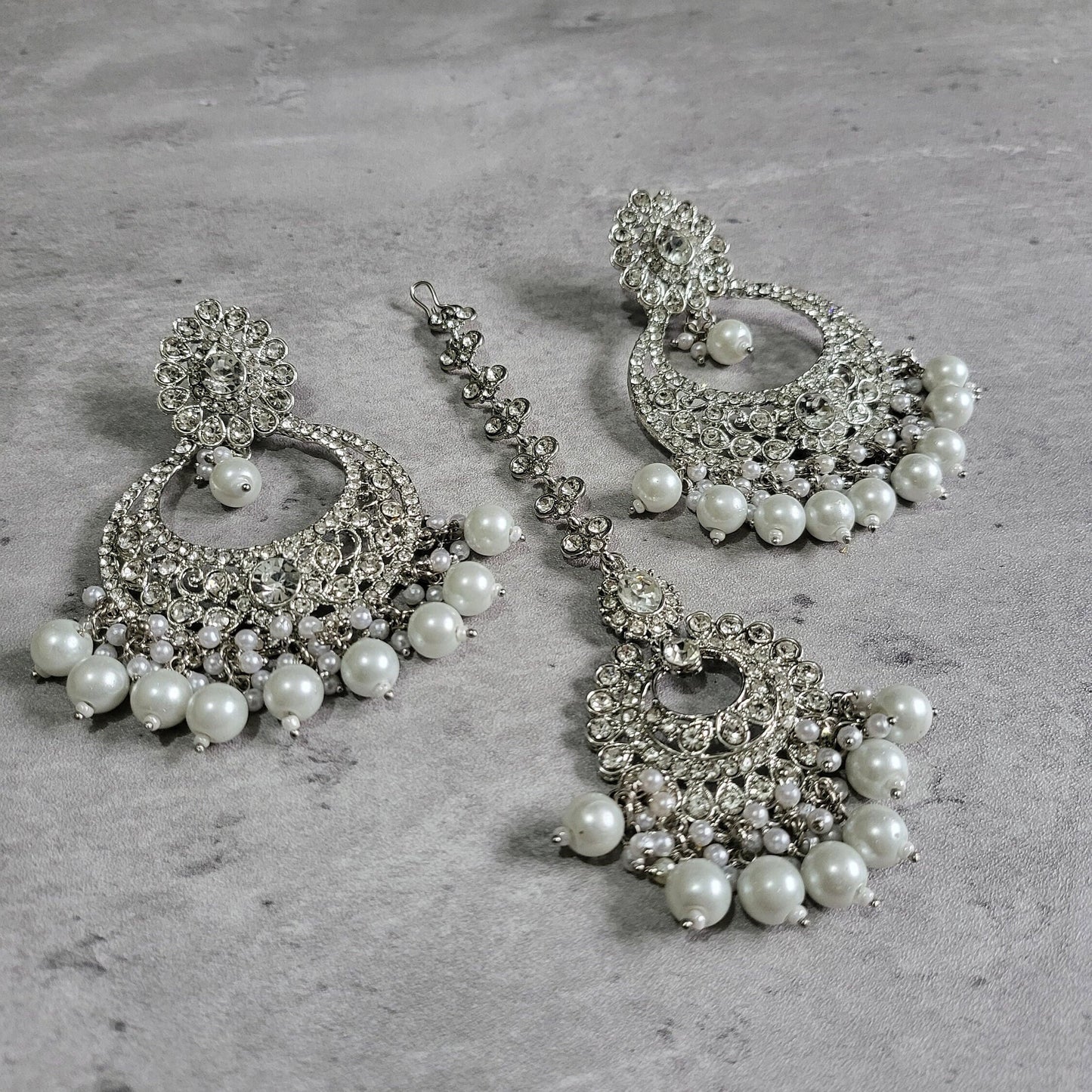 silver earrings and mang tikka set 