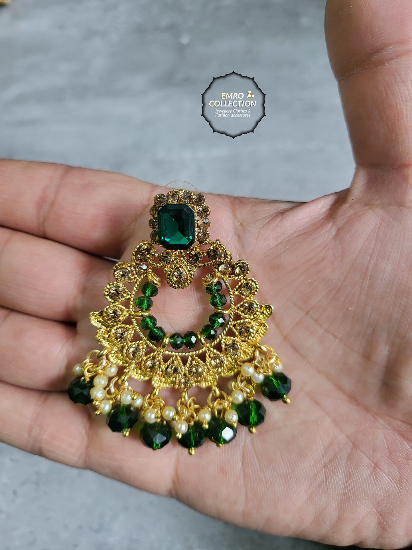 green earrings and mang tikka set