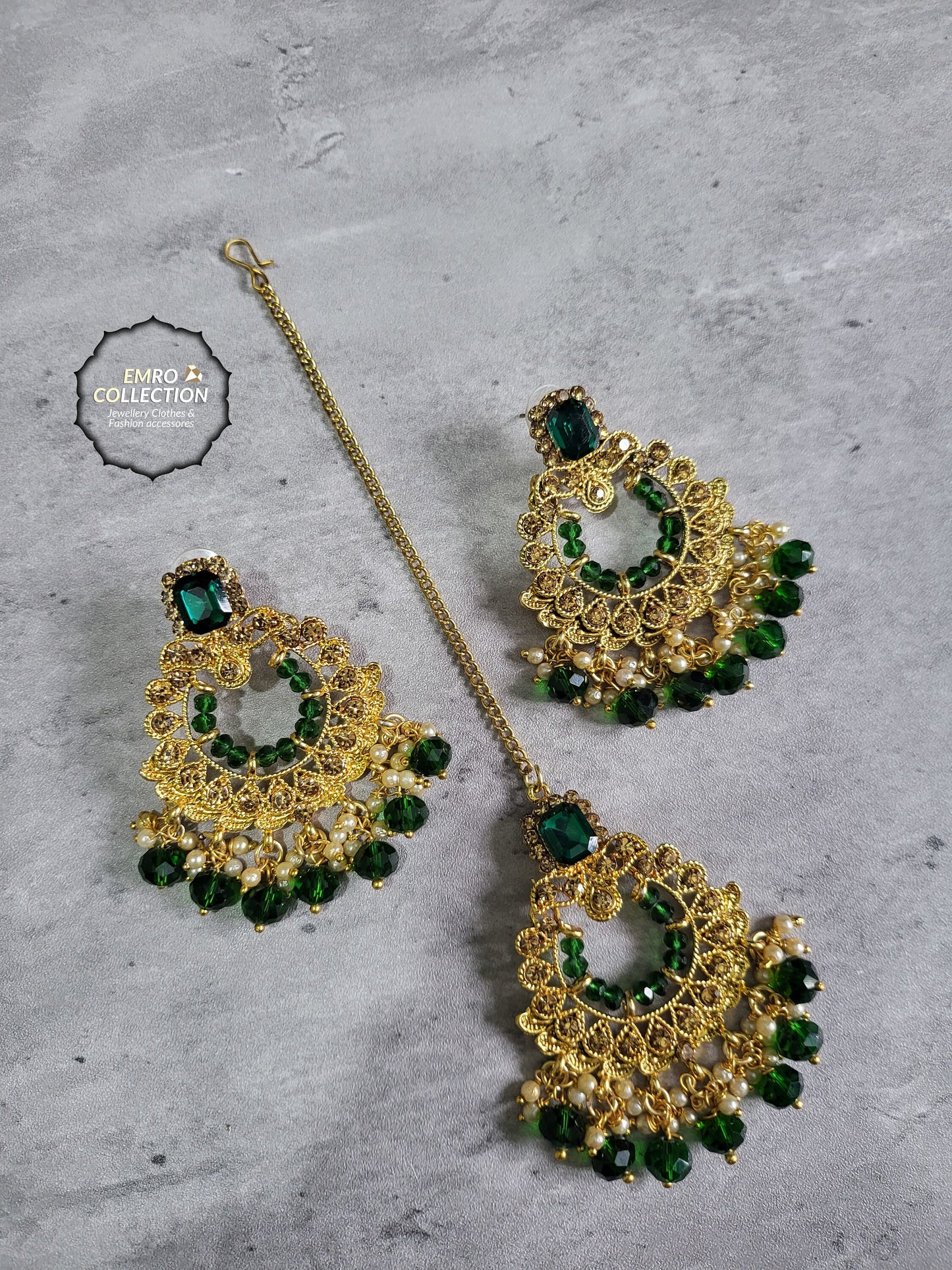 green earrings and mang tikka set